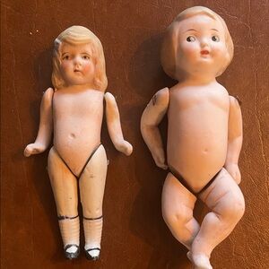 Two porcelain vintage dolls